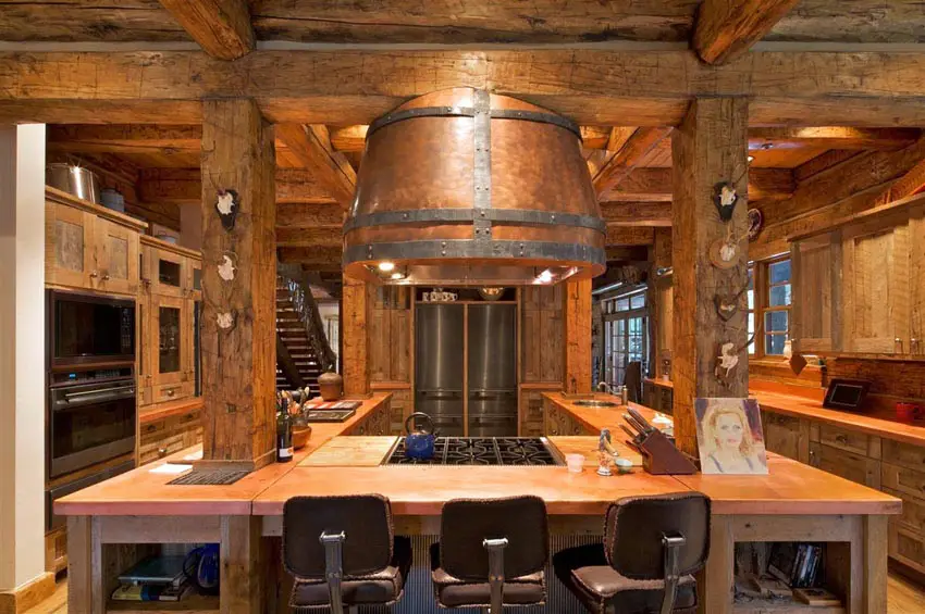 Wood beam kitchen with u shaped island and wood countertops