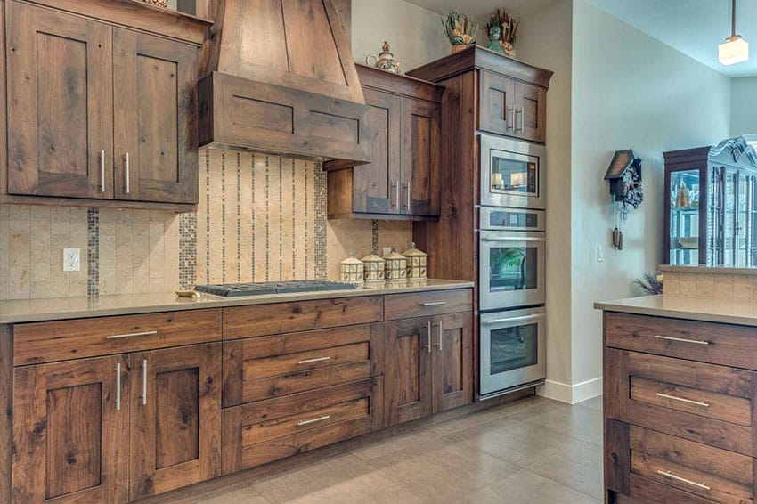 Kitchen with custom range hood and porcelain flooring