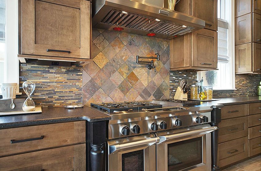 Craftsman kitchen with flat panel cabinets and slate backsplash