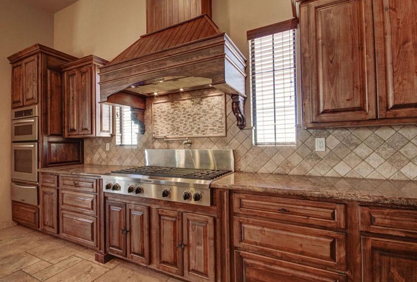 Kitchen with rustic raised panel cabinets and beige granite countertops