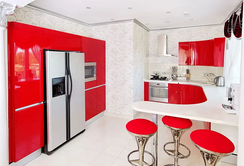 Kitchen with red modular cabinets and peninsula