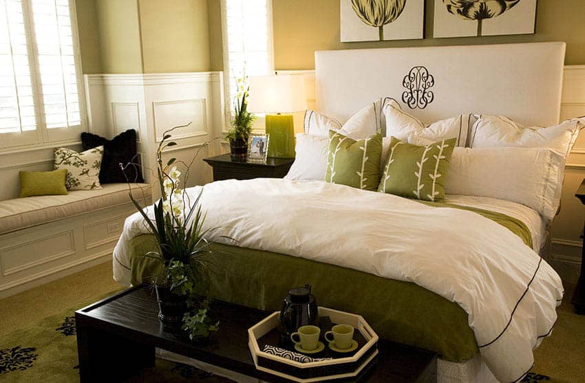 Master bedroom with green painted walls and decor