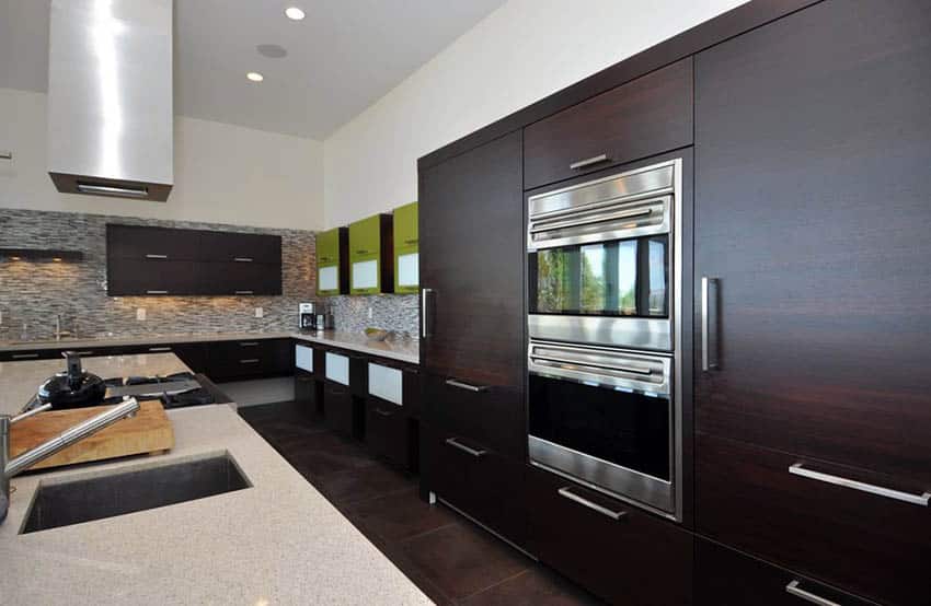 Modern kitchen with dark cabinets and iced white quartz countertops