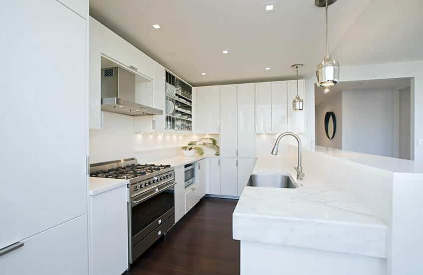 Modern kitchen with gloss white cabinets and calacatta marble countertops
