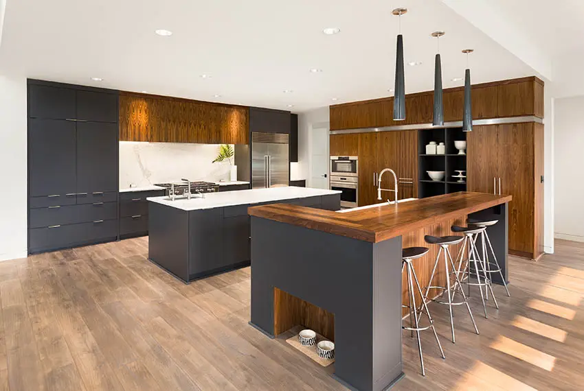 Kitchen with chef's block countertops and two islands