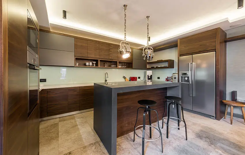 Kitchen with wooden cabinets and gray island 