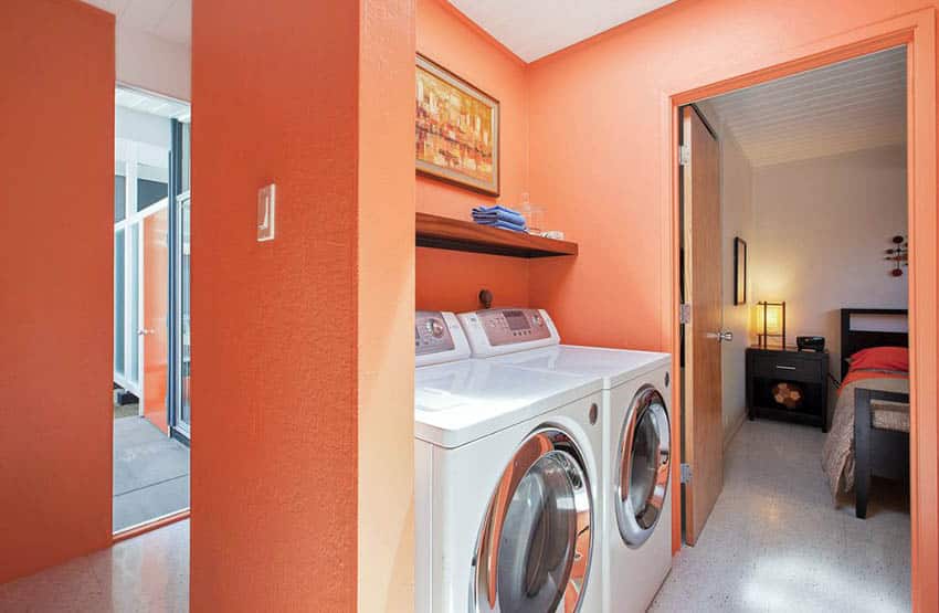 Orange painted laundry room