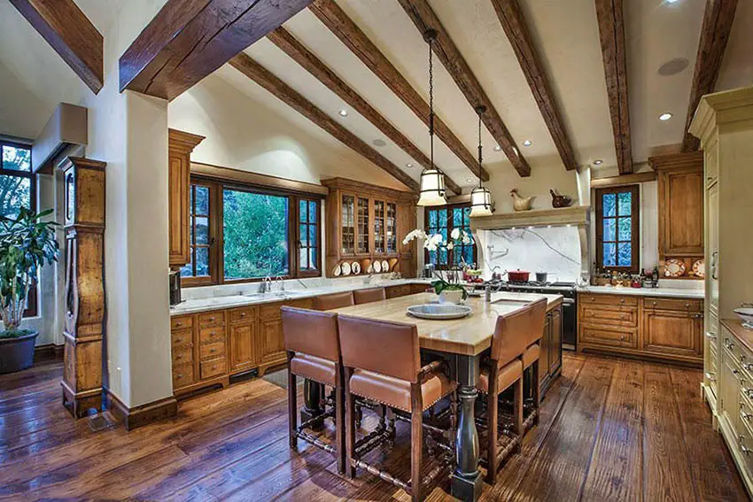 Kitchen with beige walls and exposed wood beams