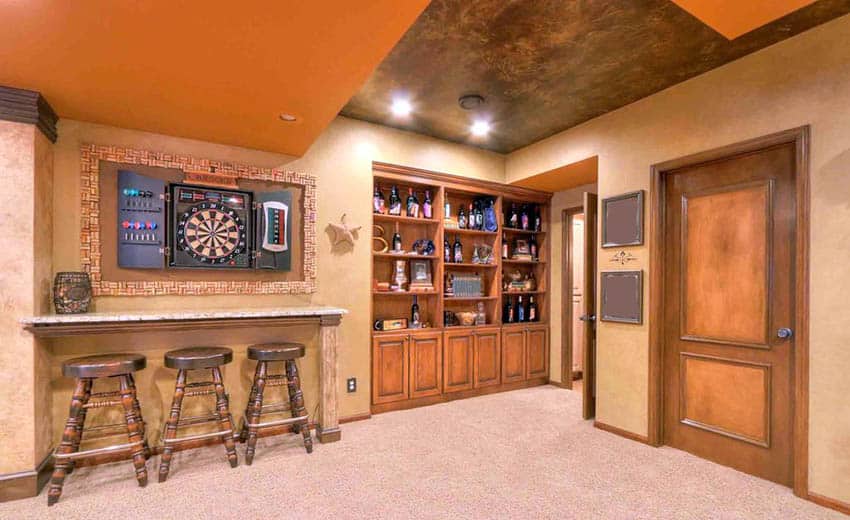 Small basement game room with orange painted accent ceiling