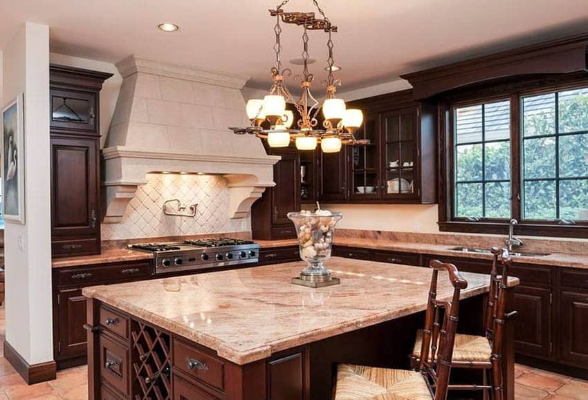 Kitchen with white ceiling, recessed lighting and square shaped island