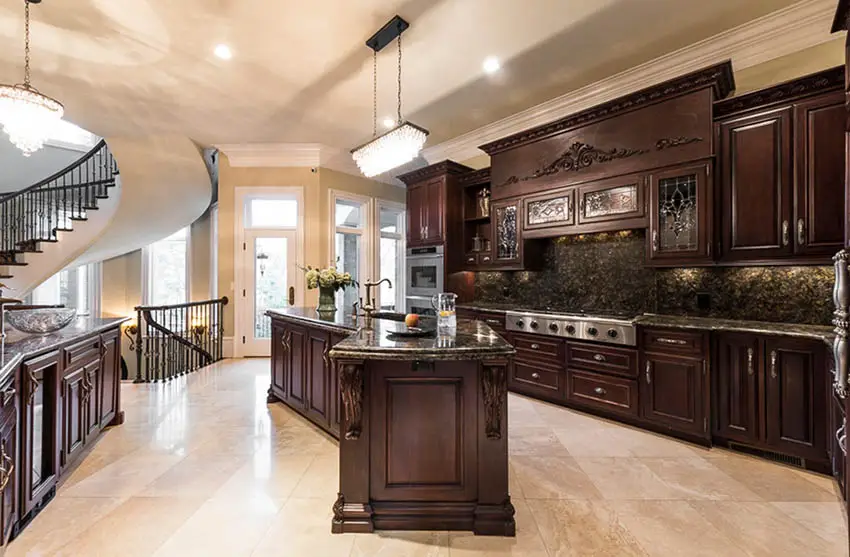 Traditional kitchen with dark lacquer cabinets and dark granite counters