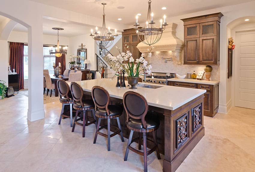 Traditional kitchen with decorative wood cabinets, large custom island and quartz countertop