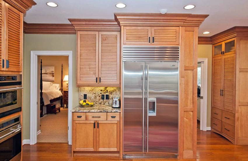 Traditional kitchen with louver style cabinets