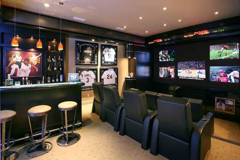 Black painted man cave with home bar and baseball theme