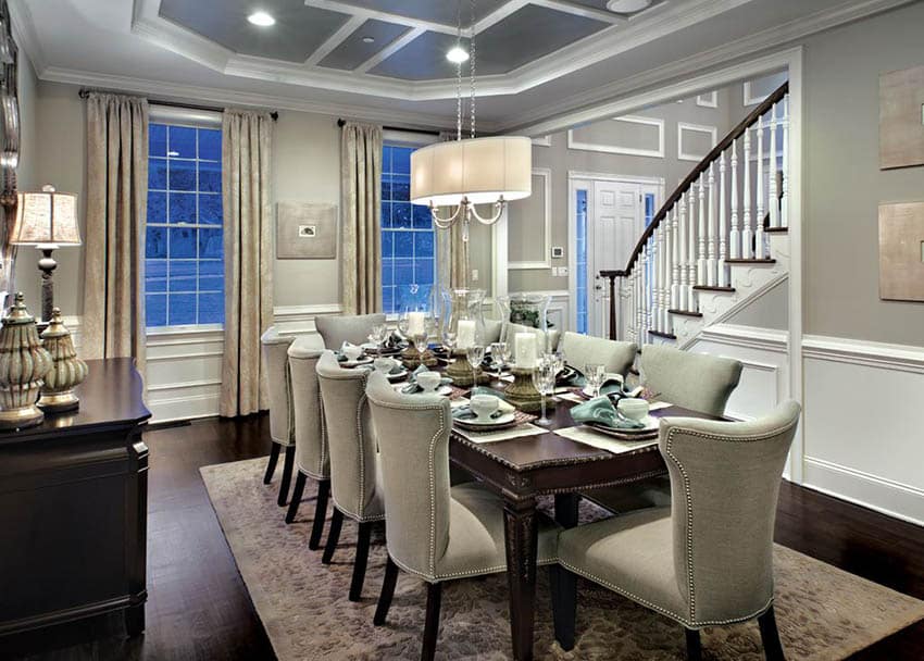 Dining room with gray and white geometric tray ceiling design