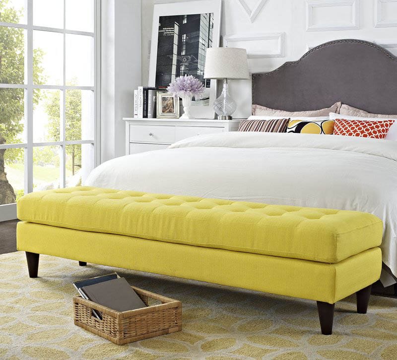 Master bedroom with yellow ottoman bench