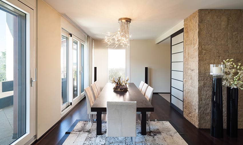 Modern dining room with semi flush light fixture with decorative prong design