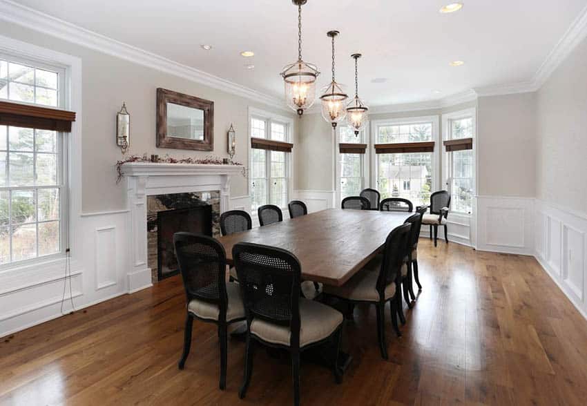 Room with fireplace, solid wood table and black chairs