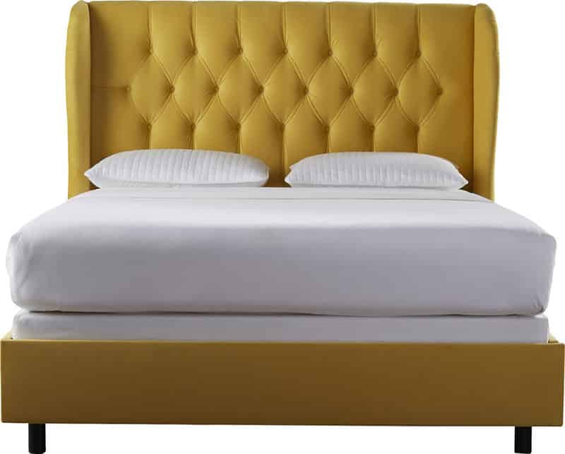 Yellow tufted upholstery bed