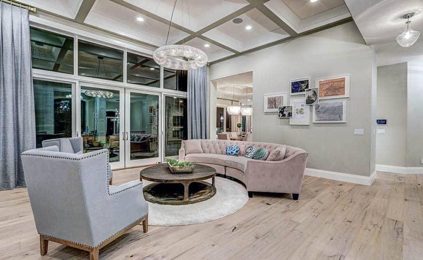 Contemporary living room with light gray paint gray curtains and chairs with wood floor