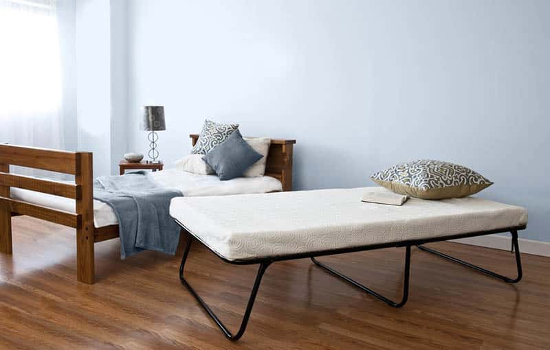 Folding bed with mattress