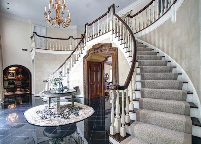 Foyer with staircase carpeting
