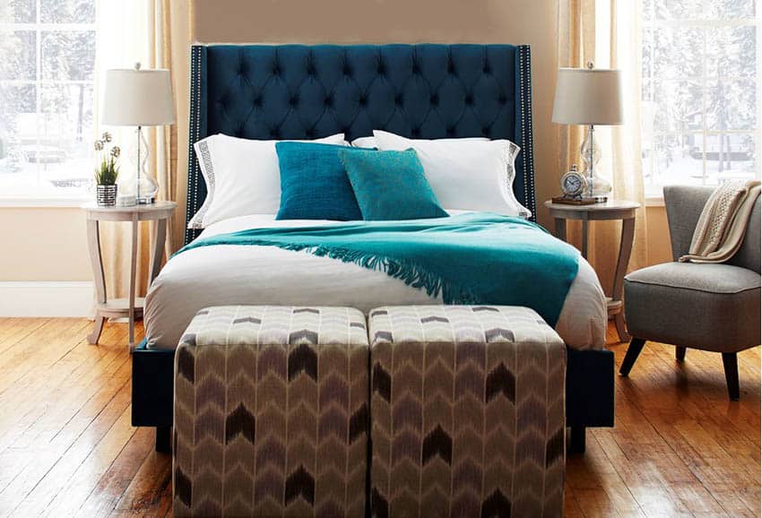 bedroom-with-beige-paint-color-and-blue-tufted-headboard
