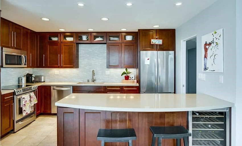 Kitchen with brown cabinetry and windy blue walls