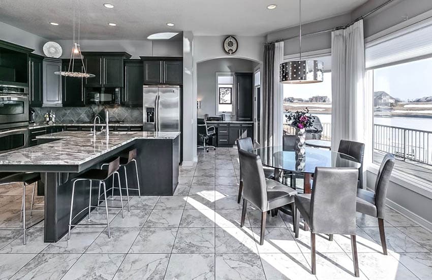 Dark cabinet transitional kitchen with gray painted walls and white marble tile floors