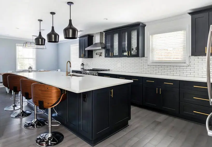 https://designingidea.com/wp-content/uploads/2018/01/kitchen-with-black-cabinets-white-quartz-countertop-wood-style-porcelain-tile-floor.jpg.webp