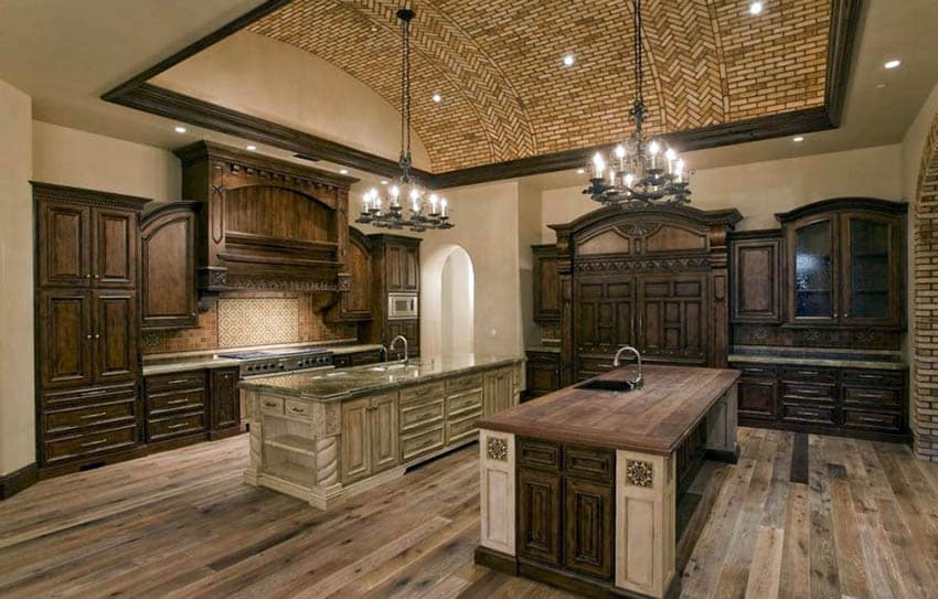 Luxury kitchen with brown cabinets and tan paint color walls with two islands