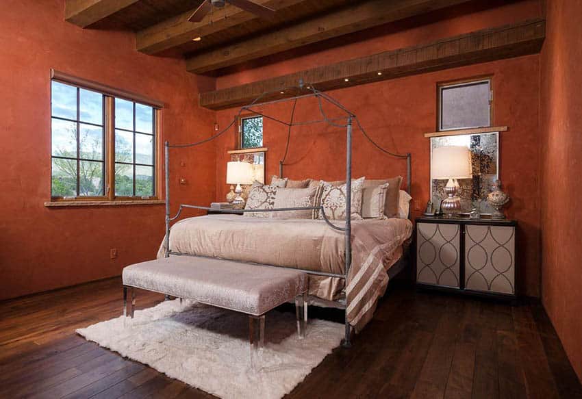 master-bedroom-with-brick-red-paint-color-and-wood-beams