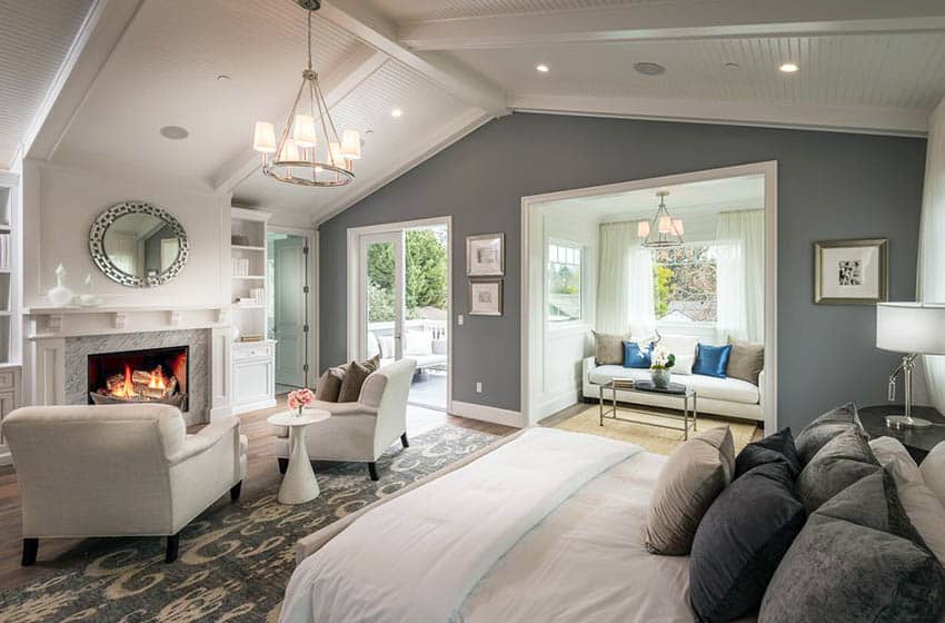 Master bedroom with white plank ceiling and beams