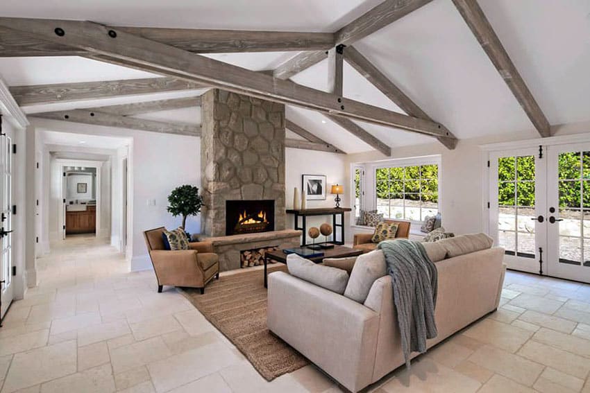 Rustic farmhouse living room with vaulted ceiling and tile floor