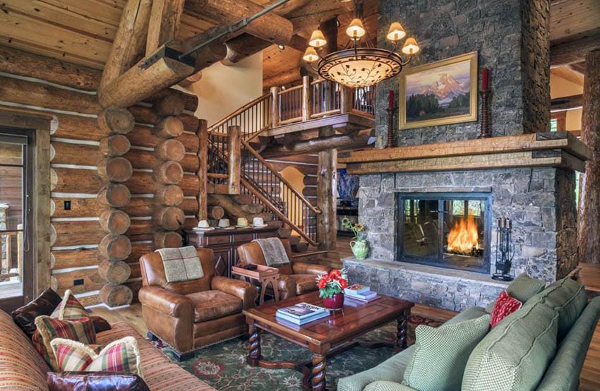 Rustic room in log cabin home with stone built fireplace