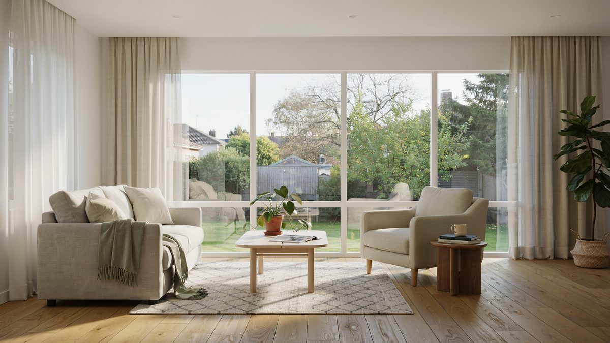 Sunroom with floor to ceiling windows, linen sofa and pale coffee table