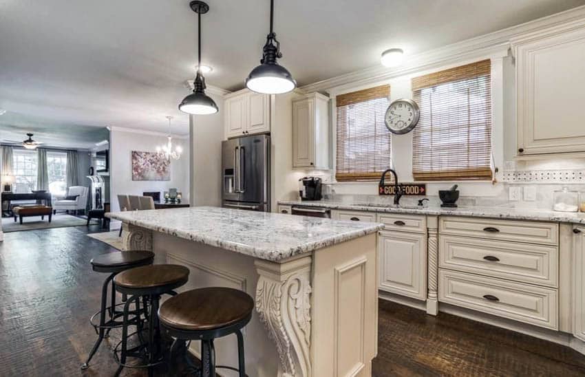 Cream cabinet kitchen with open concept to living room