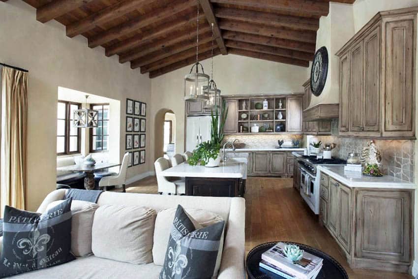 Open concept kitchen and living room with eat-in dining, marble countertops and arabesque backsplash tile