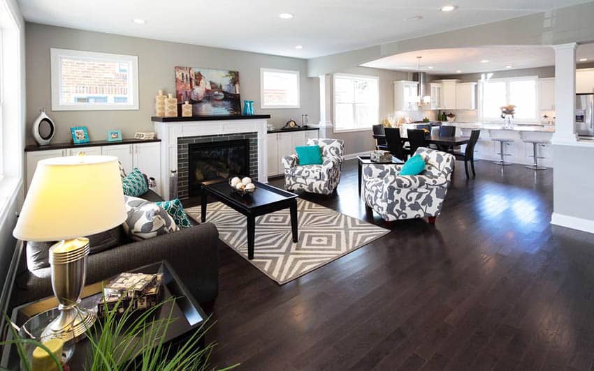 Transitional living room with prefinished oak wood flooring with dark finish