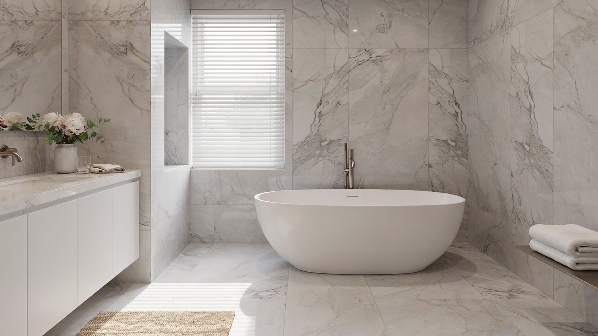 All white marble bathroom with a clean vanity, freestanding tub, and metal fixtures