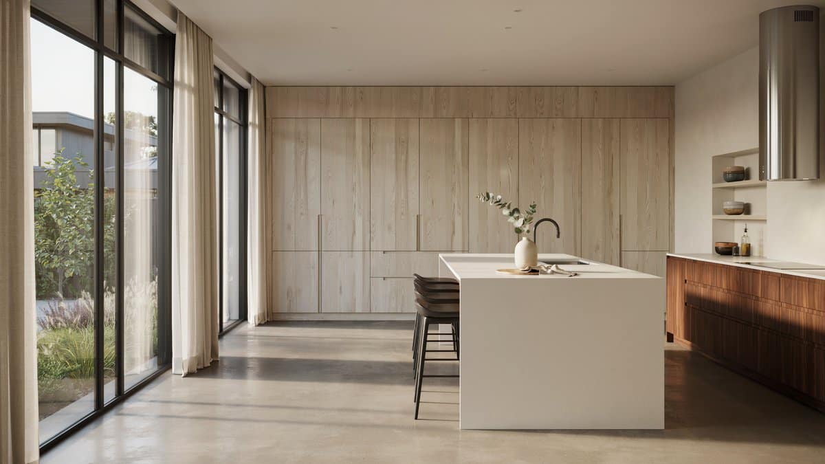 Pale pickled-oak kitchen with a waterfall island and wide bright windows