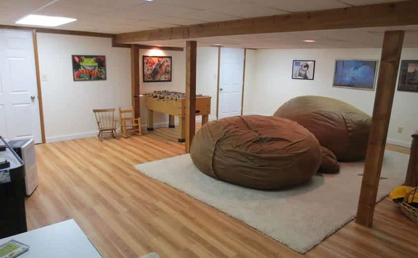 Game room with two large bean bags, grey carpet and table hockey