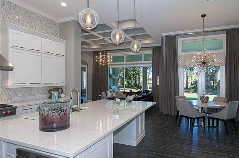 Contemporary kitchen with open concept dining breakfast nook and living room