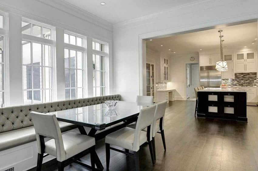 kitchen open to wall of windows with built in bench