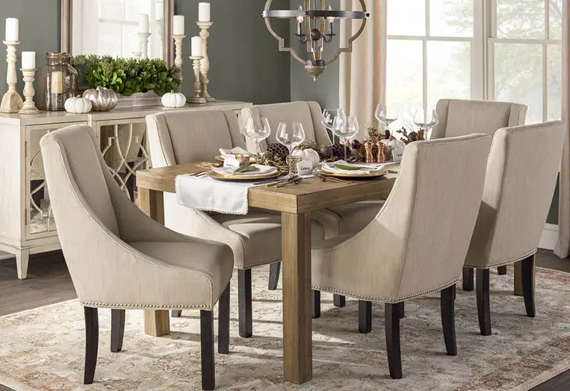 Candle style chandelier with an upholstered six-seater dining set