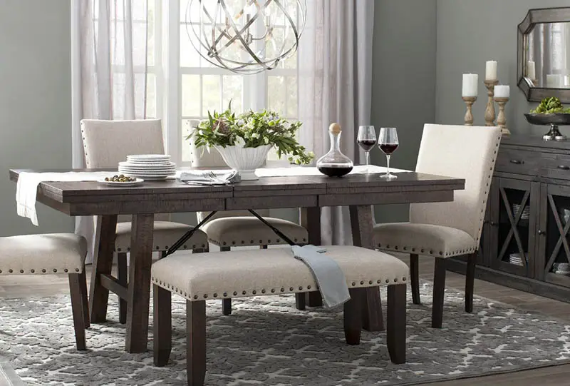 Table with white runner and chairs with globe chandelier