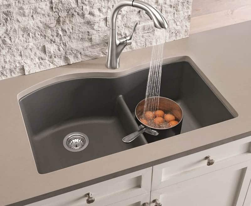 Granite stone material sink with low divider