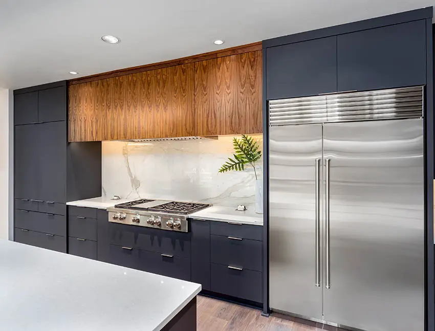 Kitchen with dark european cabinets and white quartz countertops