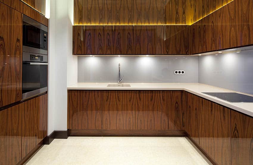Kitchen with veneer wood cabinets and push to open hardware