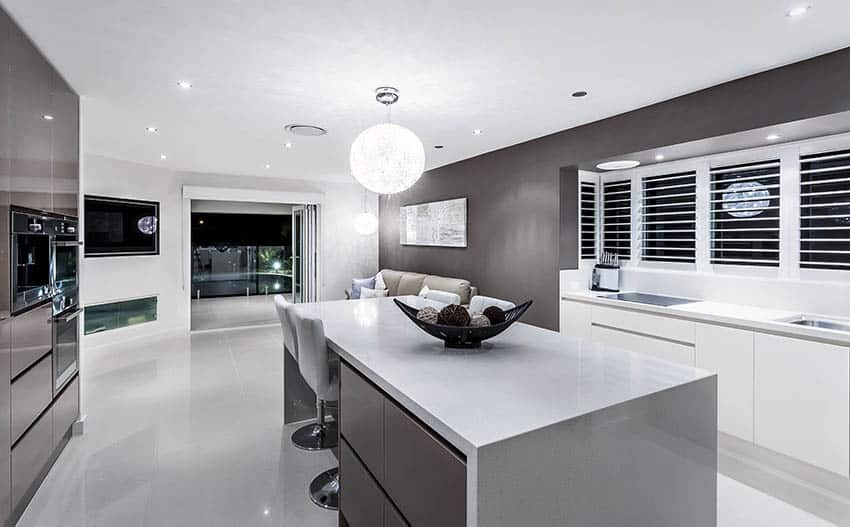 kitchen with dark gray cabinets and globe light fixture